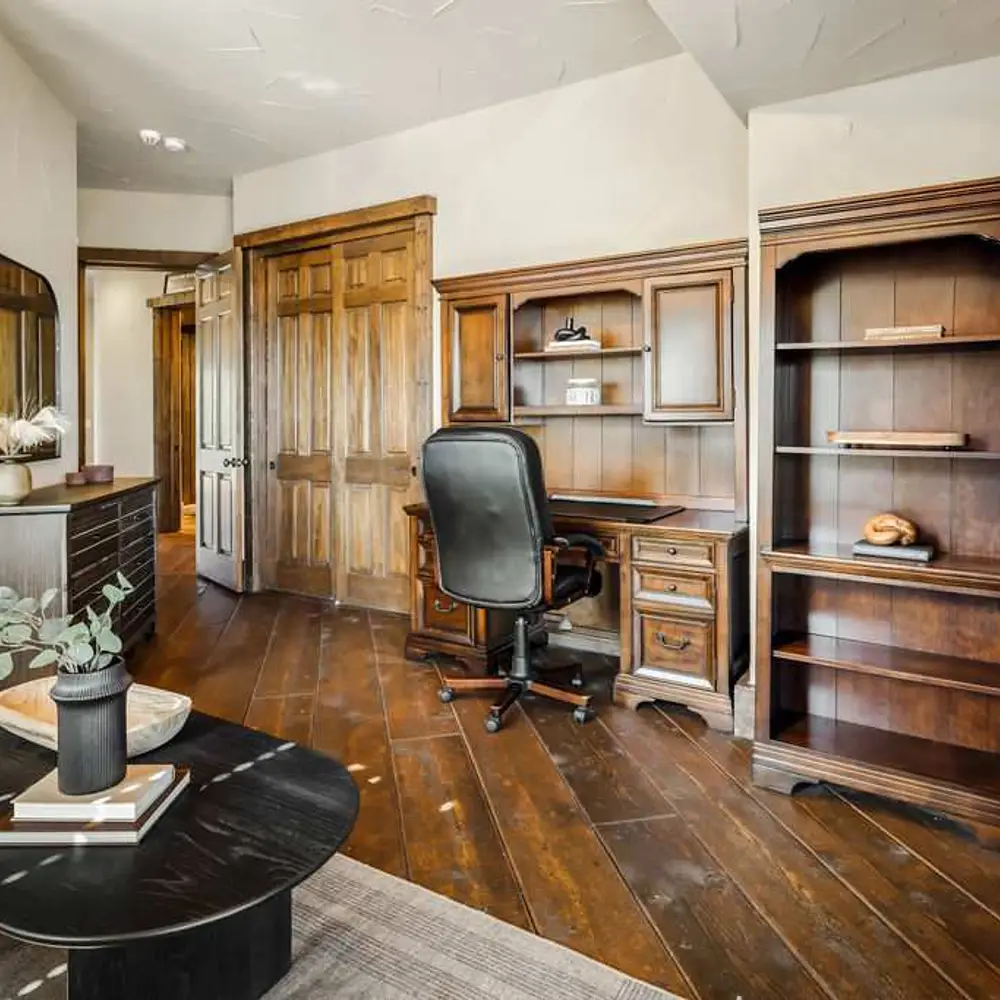 Office with workspace, queen-size sleeper sofa, private balcony, and private half bathroom