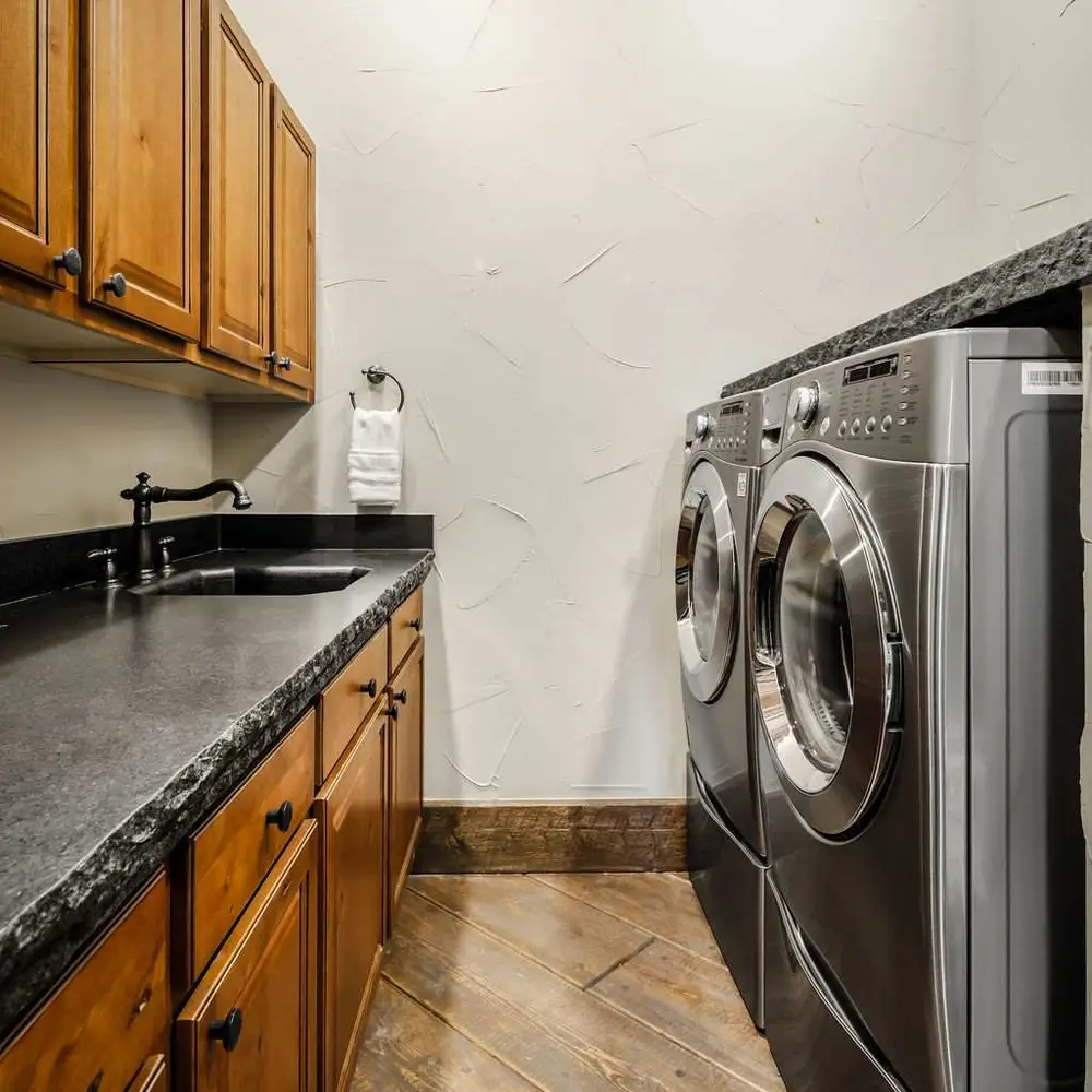 Laundry room with a front-loading washer and dryer