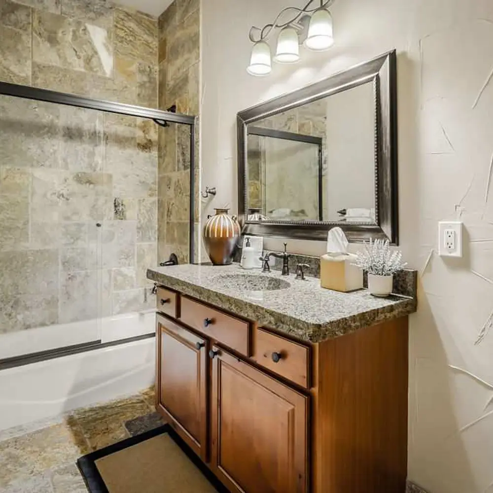 Bedroom 2 private full ensuite bathroom with tub shower combo
