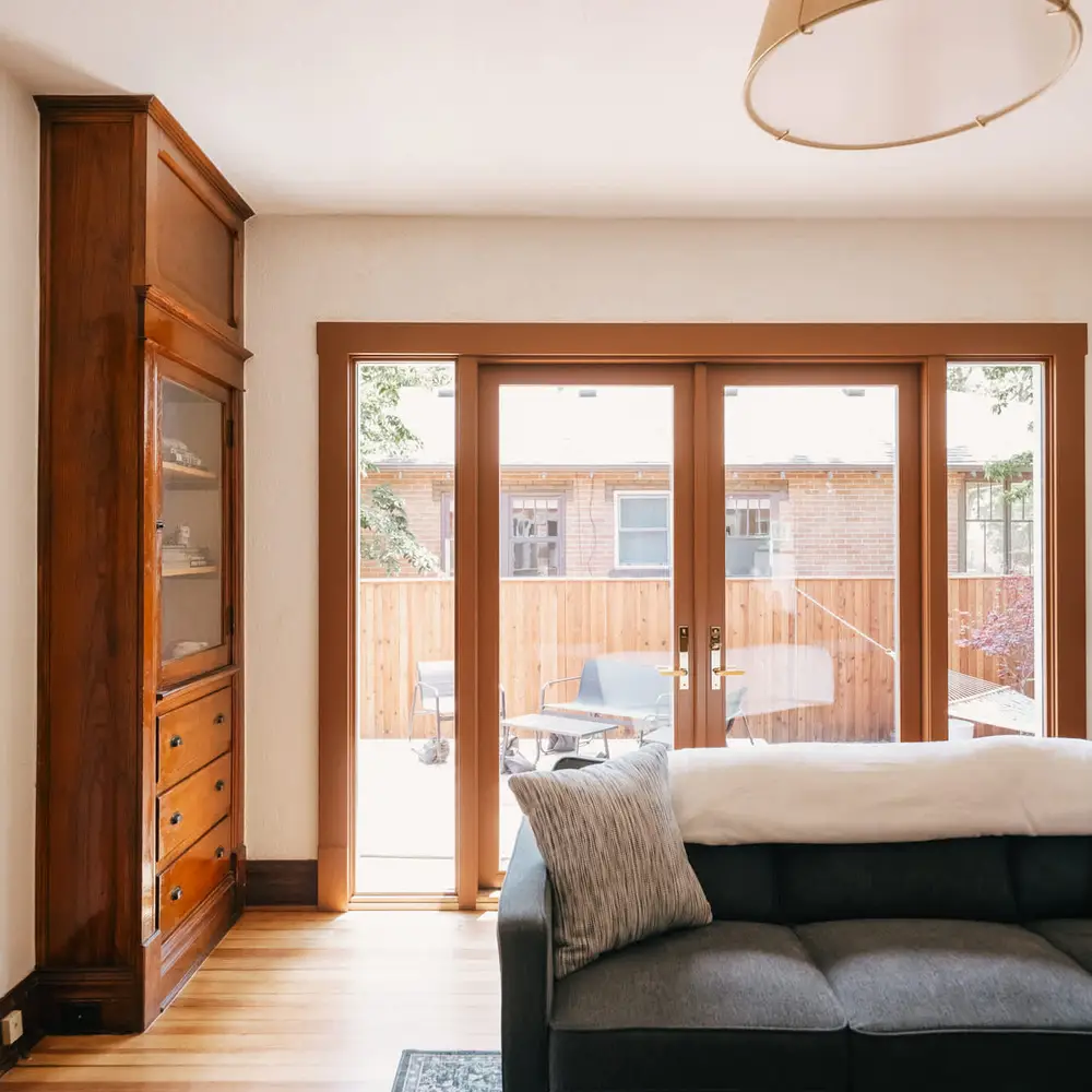 French doors lead to outdoor seating