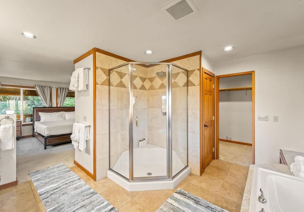 Primary bathroom with separate tub and shower