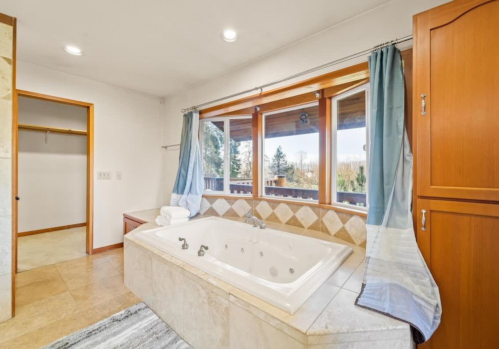 Primary bathroom with separate tub and shower