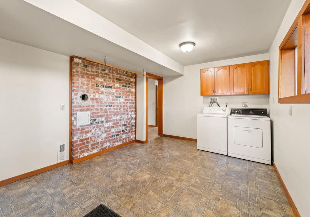2 of 2 laundry rooms at the house, this one located in the basement.