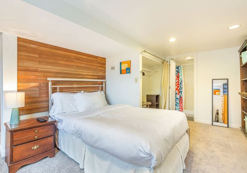 Downstairs bedroom with a full size bed.