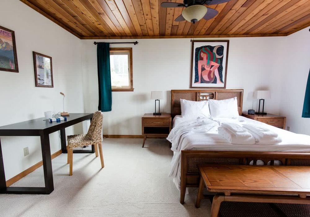 Primary bedroom with Queen bed, luxury bed linens and comfy robes.