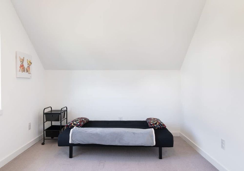 The second bedroom includes a desk, desk chair and futon suitable for 1 person.