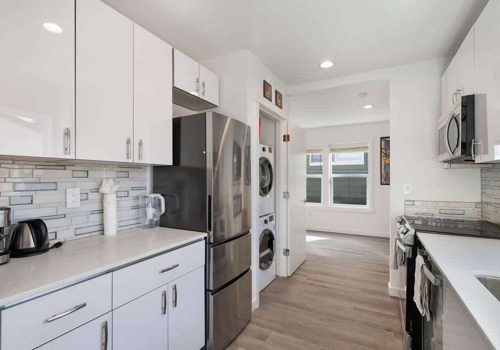 The washer and dryer are located in the kitchen area.
