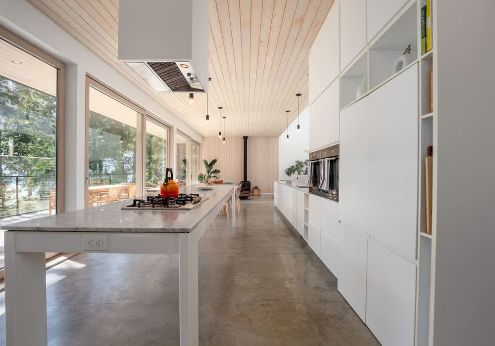 Walking in to the full kitchen and open concept living space.