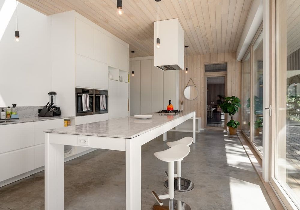 Walking in to the full kitchen and open concept living space.