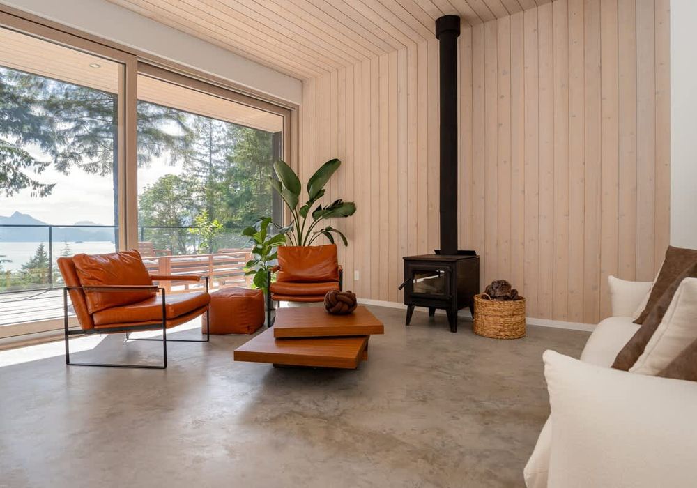 Relax with incredible views in the open living space with easy access to back deck
