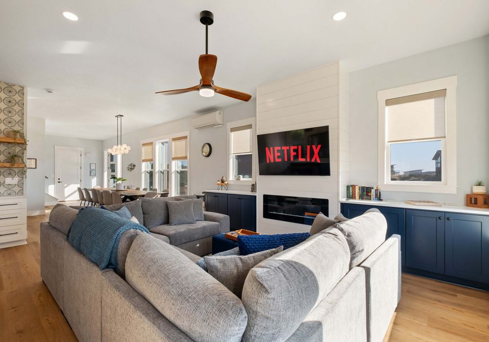 Watch a movie or light the fire—spacious main floor layout with seating for all.