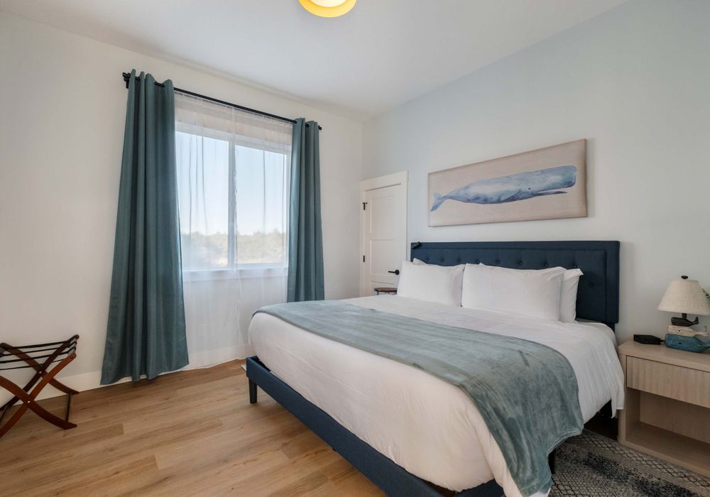 Comfortable and quiet—king bed with nightstands and blackout curtains.