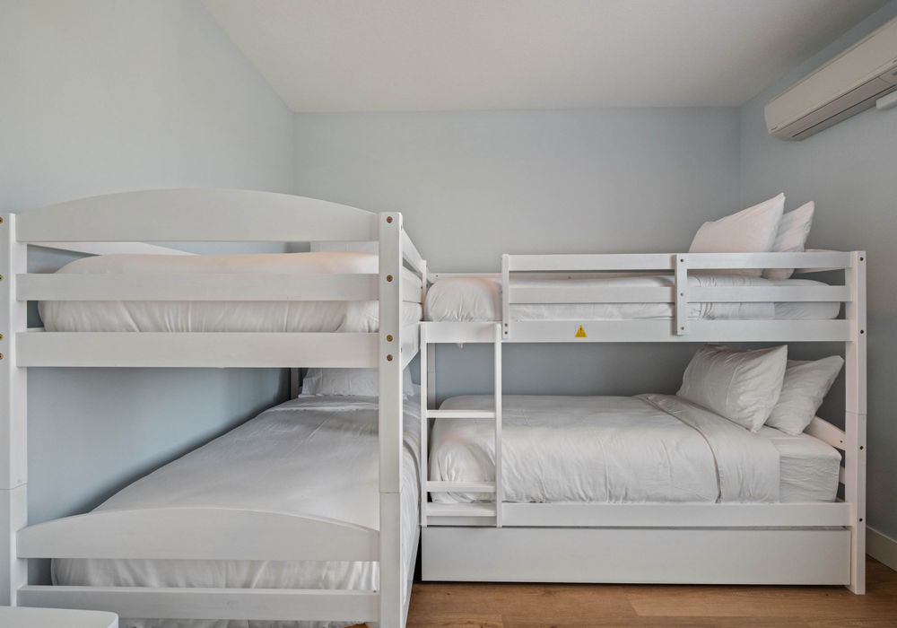 Perfect for kids or groups—sleeps five with pullout trundle bed below.