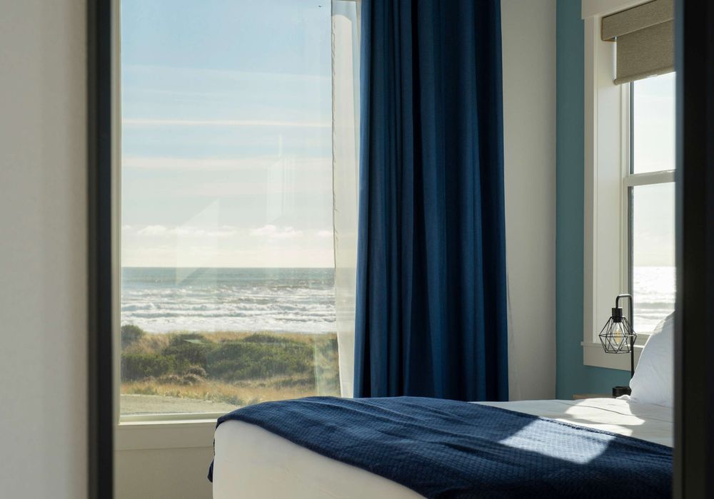 Wake up to the waves—ocean views right from bed in this bright upstairs room.