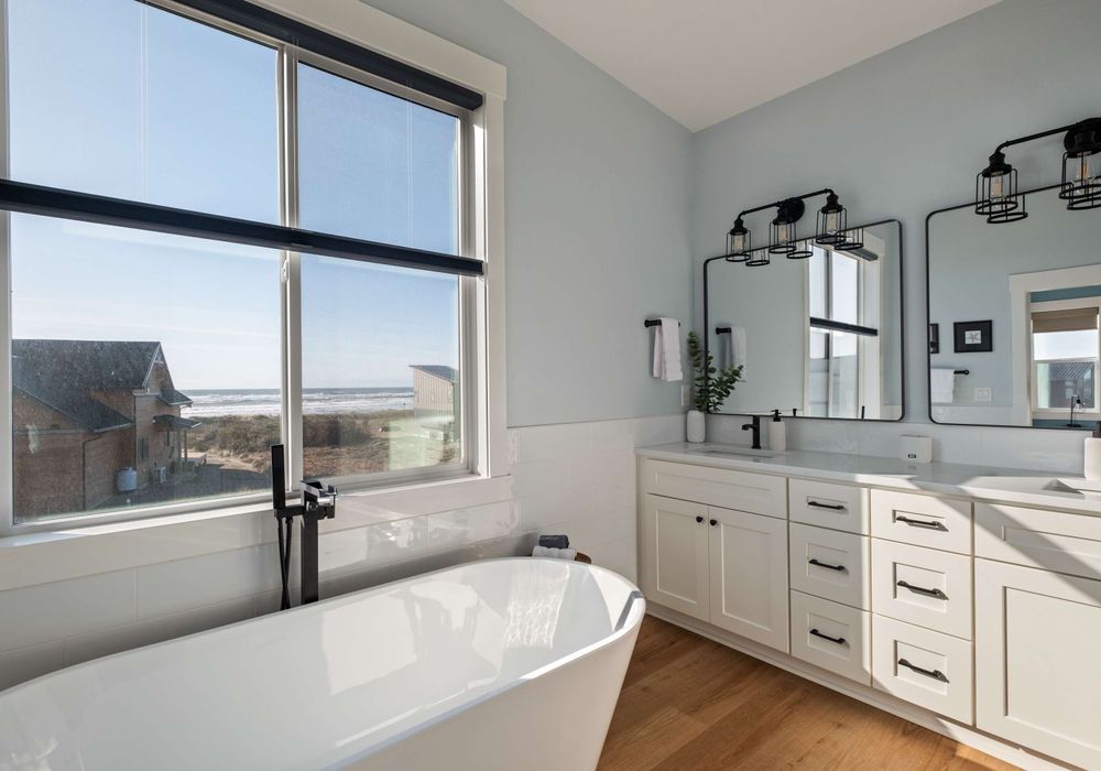 Relax in the tub or rinse off in the large shower—windows bring in the view.