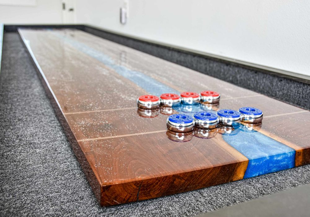 Challenge friends to a game—shuffleboard and foosball ready for use.