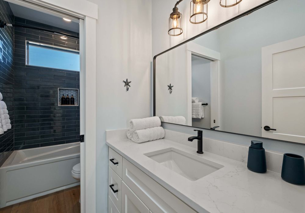 Bathroom 3 of 3 - Bright finishes and storage space.