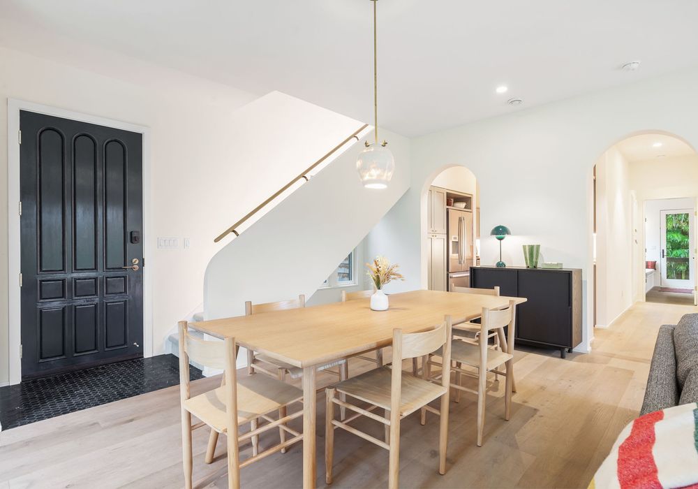 Gather around a spacious dining table with plenty of seating for all.