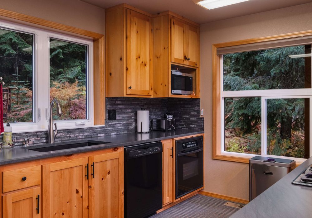 The contemporary kitchen with modern appliances invites you to channel your inner chef and savor every meal in style.