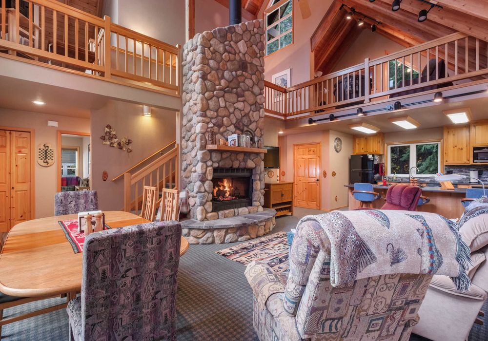 With a firepit as the centerpiece, this living room offers a warm, inviting space for relaxation and conversation.