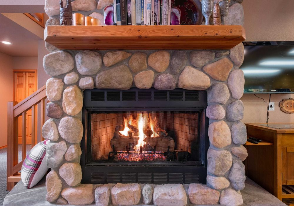 Enjoy the comfort of an indoor firepit that brings both warmth and charm to the living room, creating a relaxing and peaceful atmosphere.