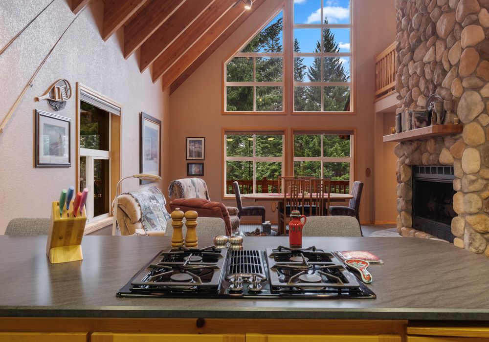 Cook with a view! This kitchen features a beautiful green landscape outside, adding a touch of tranquility to your culinary creations.