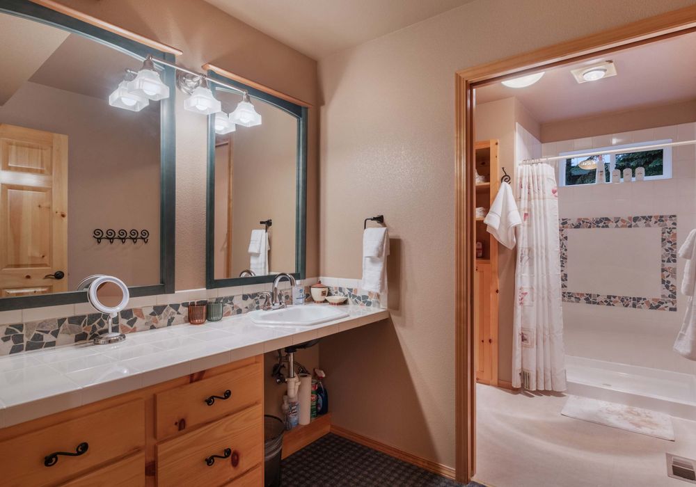 A wood-inspired vanity sink with sleek, contemporary fixtures brings a warm, inviting touch to your bathroom.