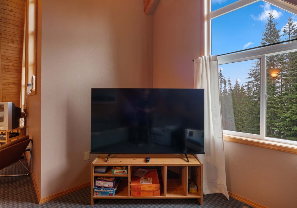 This TV is perfect for watching movies or shows, complemented by ambient lighting for a relaxed vibe.