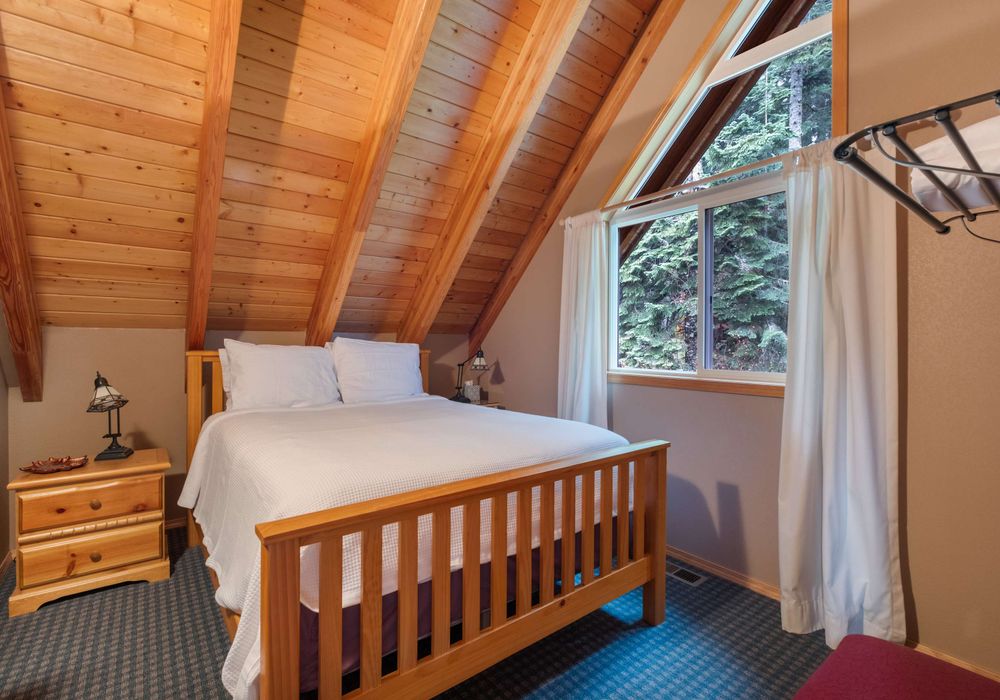A restful sanctuary, this bedroom with luxurious bedding and ambient lighting offers a perfect balance of comfort and style for your ultimate relaxation.