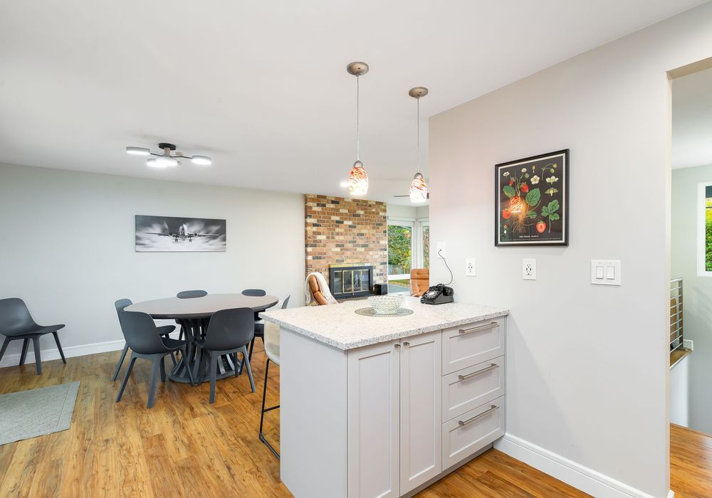 This bright dining area features a great seat that blends comfort with style, perfect for leisurely meals or family dinners.