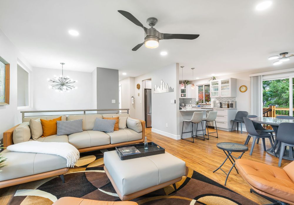 The cozy living room blends comfort and style, flowing effortlessly into the elegant dining room for a seamless living experience.