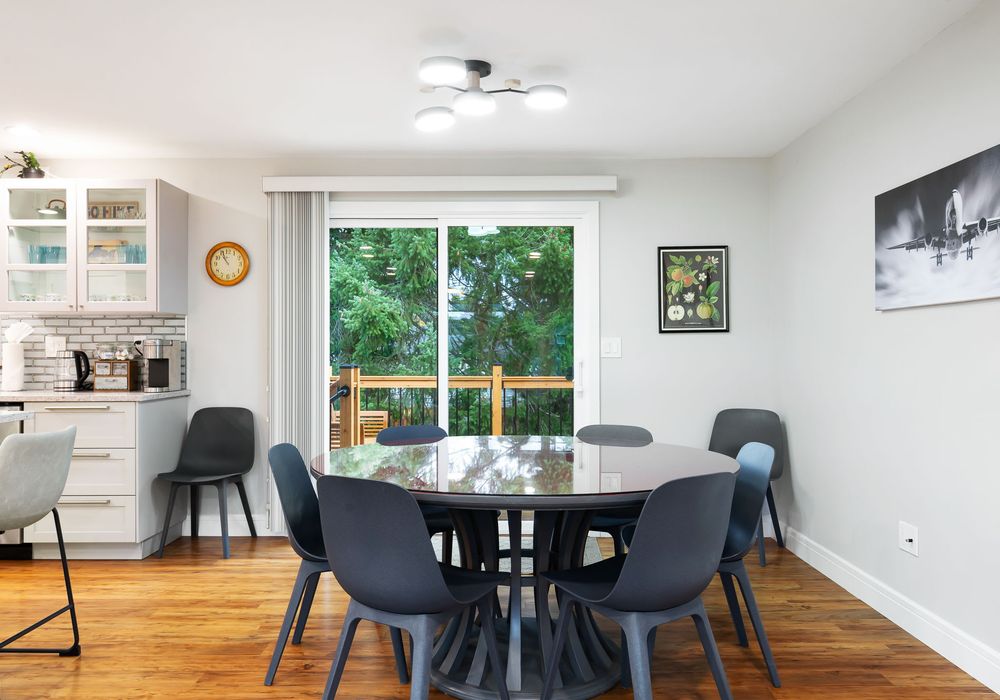 Enjoy meals in the spacious dining area, just steps away from a modern, fully equipped kitchen.