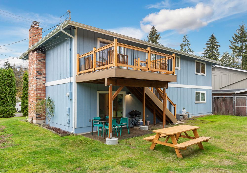 Enjoy wide-open spaces with a large yard in front, on the sides, and out back, complete with an upstairs deck for added outdoor living.