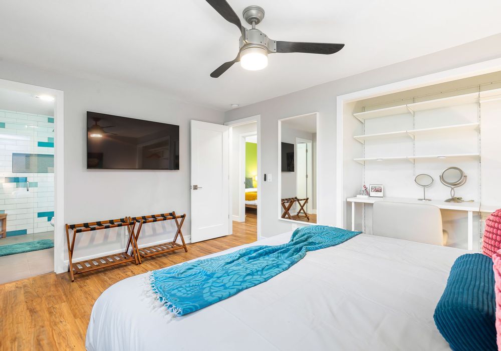 The bedroom features a convenient en-suite bathroom and a TV, combining comfort with practicality.