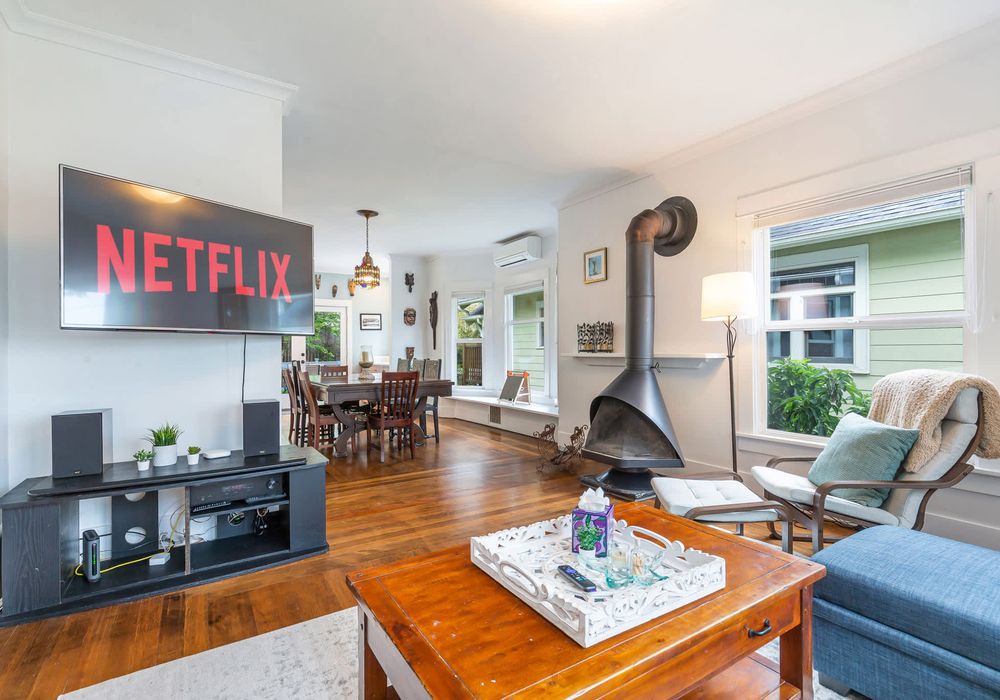 Open living area, leads to dining and kitchen.