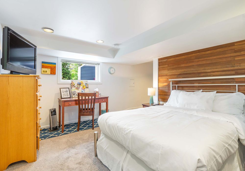 Downstairs bedroom with a full size bed.