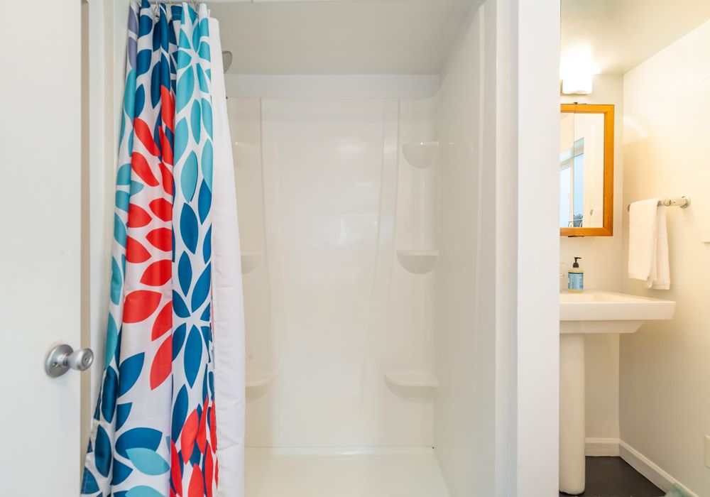 Downstairs bathroom with a stand up shower.