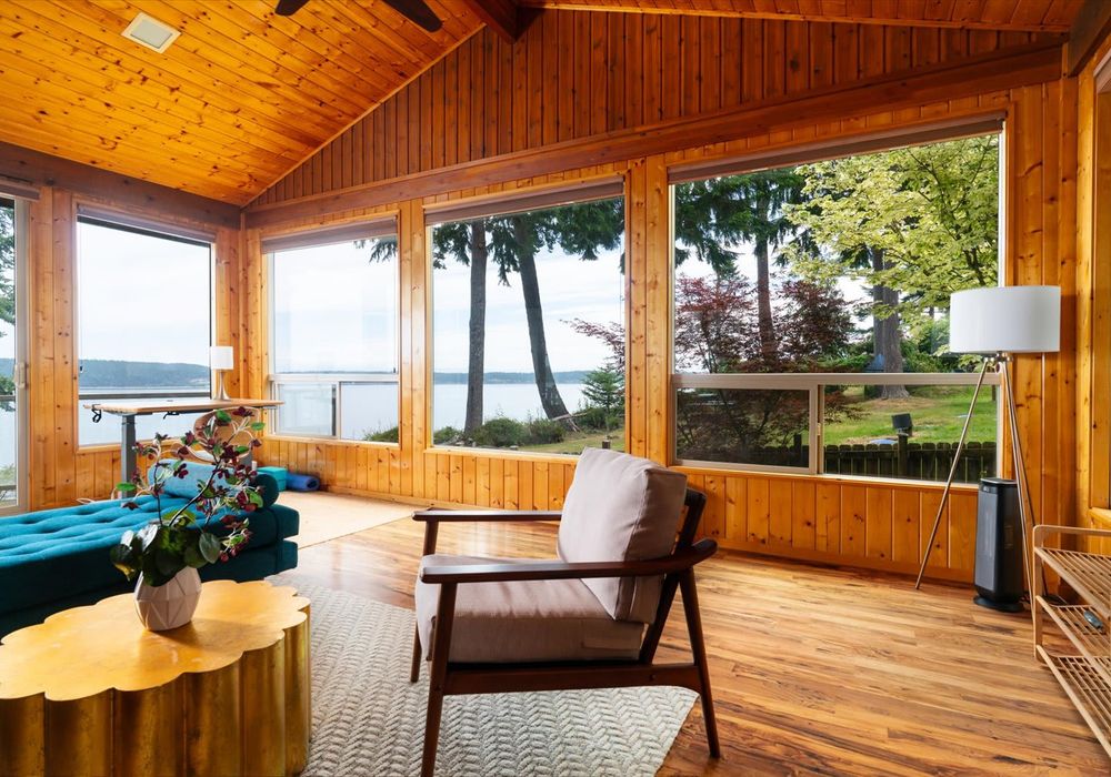 Entryway living room looks toward the water. The furniture moves easily if you need to reconfigure.