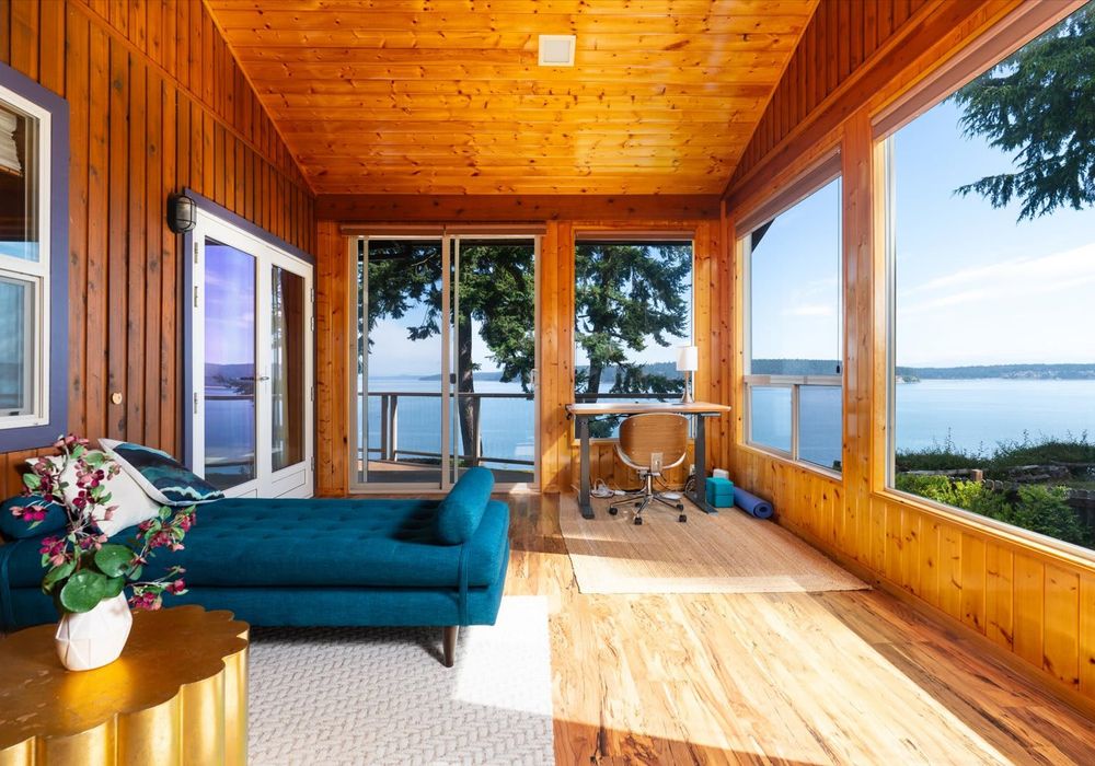 The entryway living area includes a desk. Open layout makes it easy to move between rooms without losing the view.