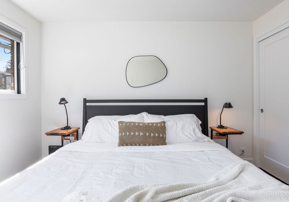King bed, soft bedding, and gentle light. Settle in and drift off.