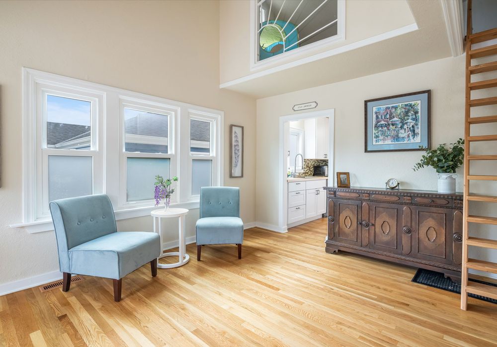 Light-filled living room with fireplace + Smart TV for cozy nights in.
