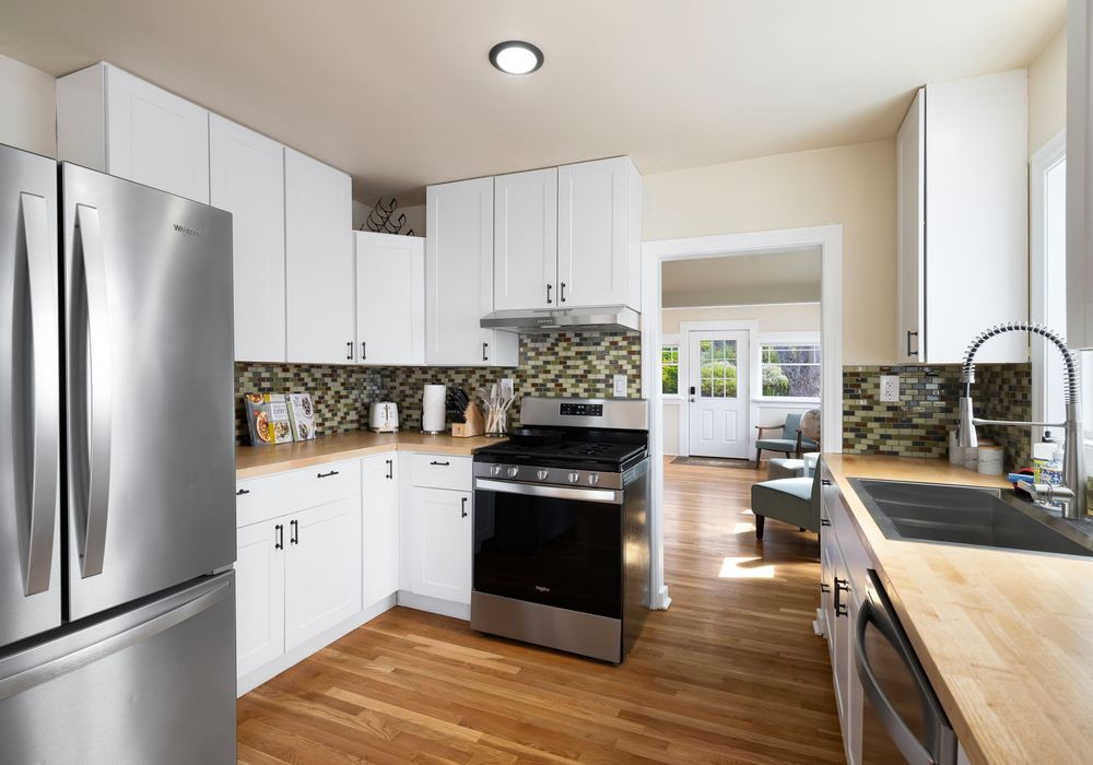 Sleek, fully equipped kitchen with stainless appliances.