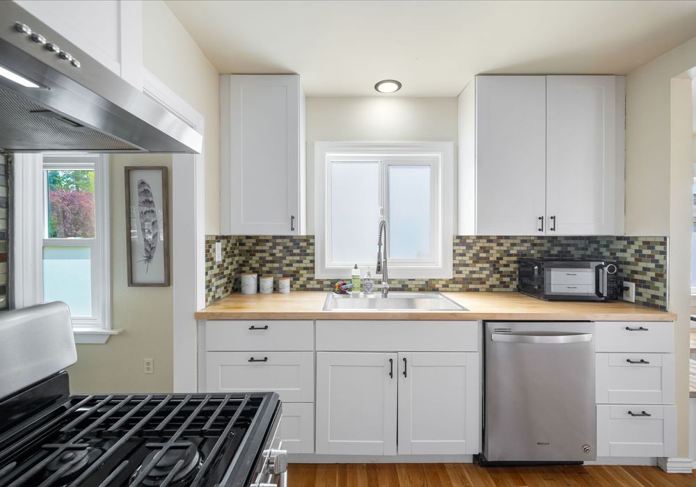 Sleek, fully equipped kitchen with stainless appliances.