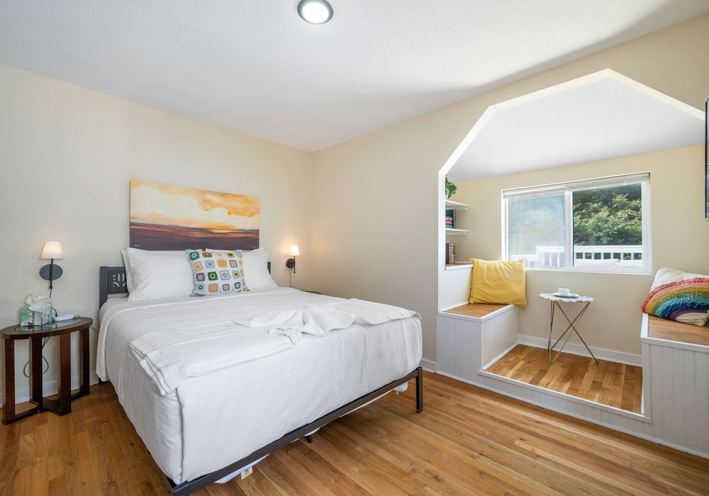 Main level bedroom with Queen bed and clean design.