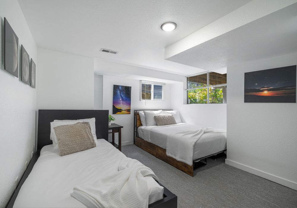 Bedroom #3, with twin and double beds.