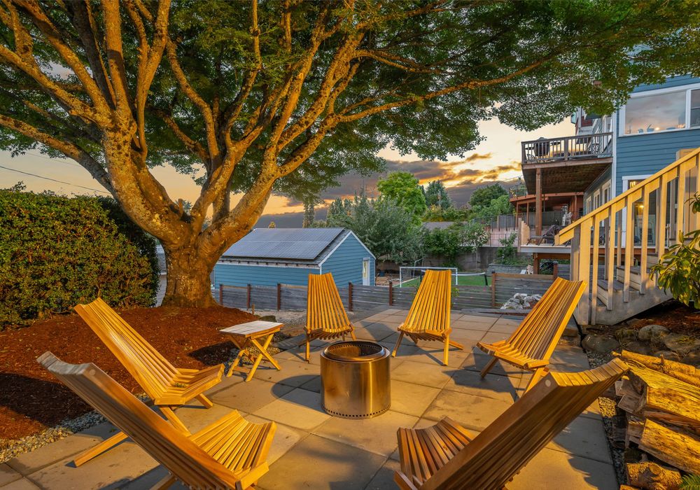 Evening glow from the backyard fire pit area, tucked into the trees.