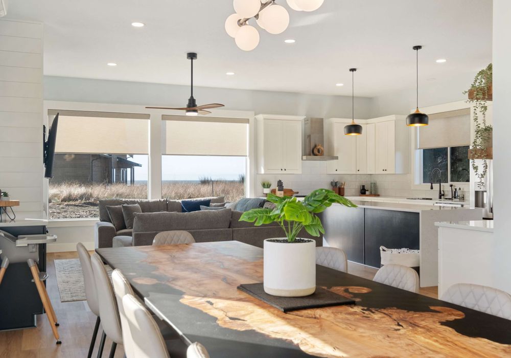 Full view of living space, with ocean views, full kitchen, and seating for your whole group.