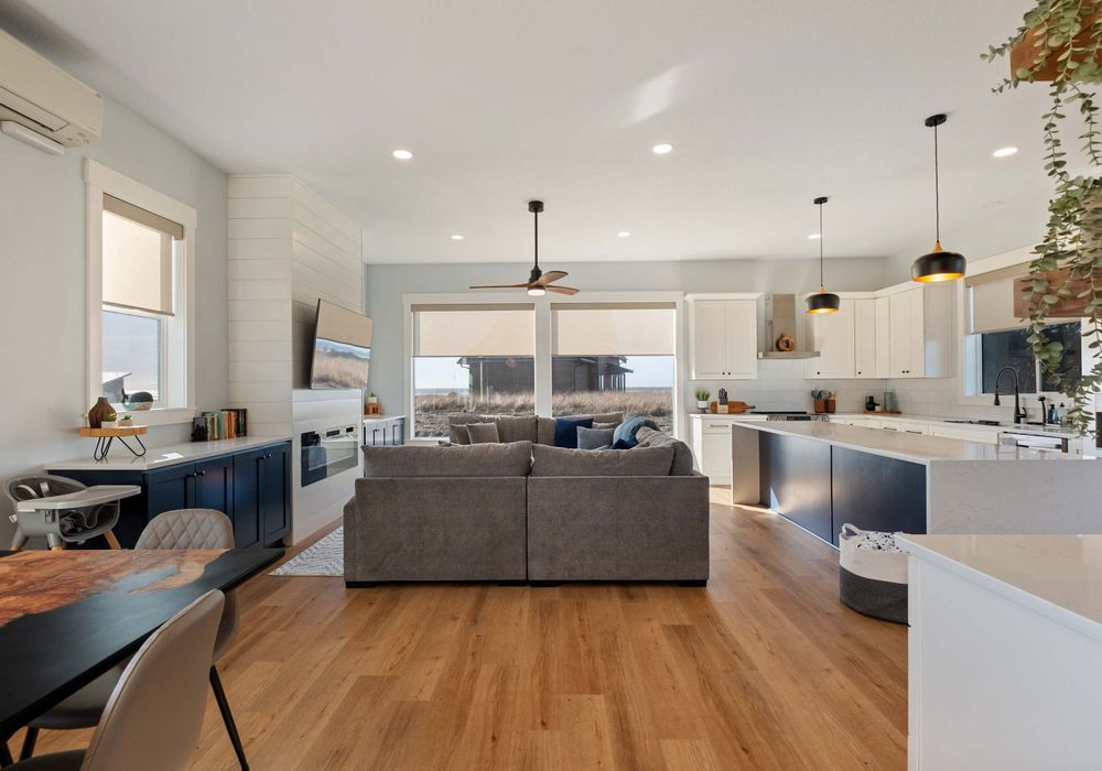 Full view of living space, with ocean views, full kitchen, and seating for your whole group.
