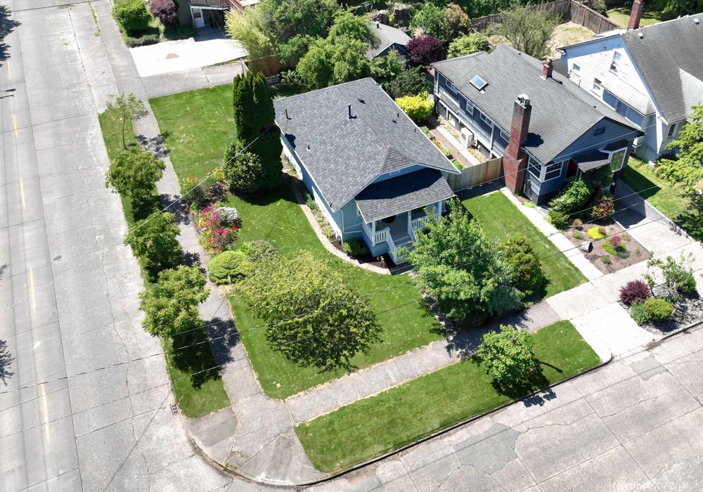 Large corner lot, plenty of green space, and walking distance to shopping and dining options.