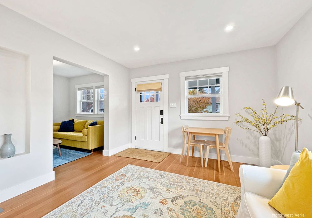 Bright and spacious living room with cozy seating.